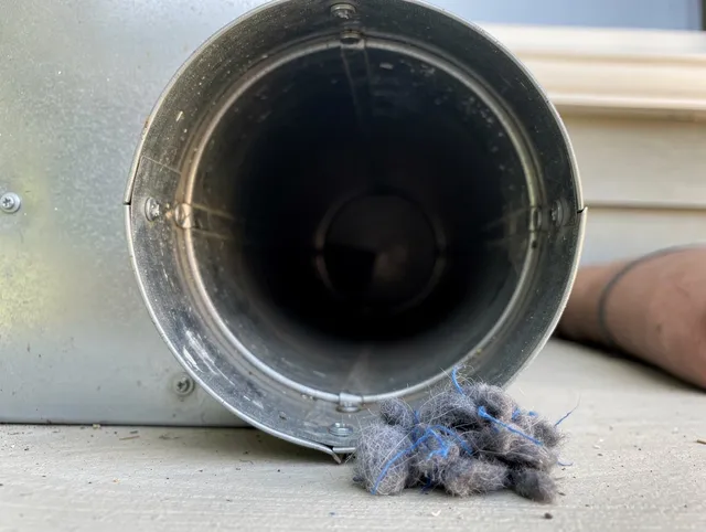 Westwood Dryer Vent Cleaning technician using specialized equipment to clear severe dryer vent blockage in Westwood